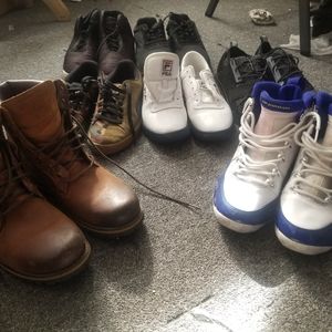Several pairs of light use Nikes Pumas Tims and mo